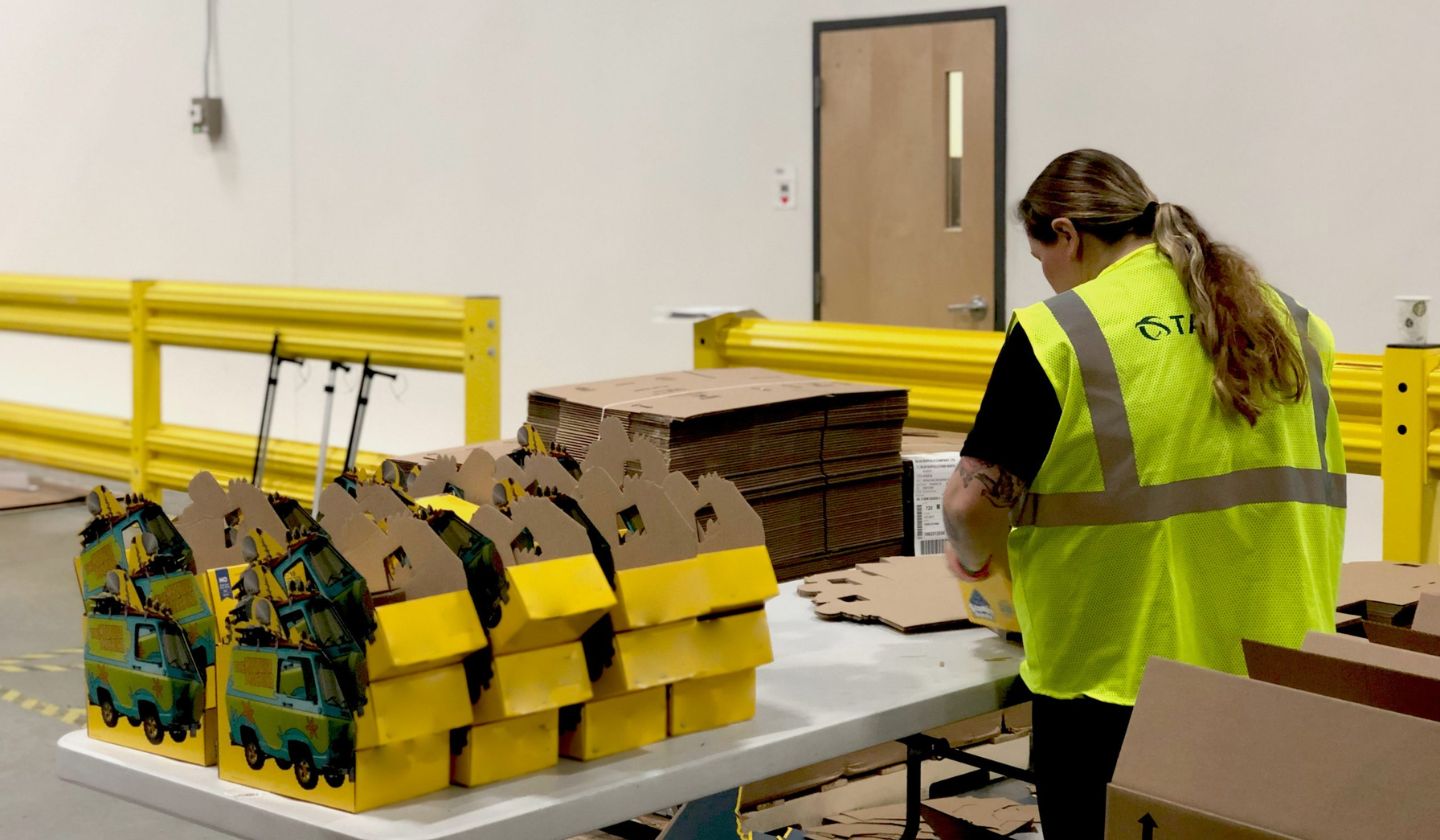 Consumer goods kits being assembled at Taylor Logistics